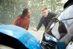 Two angry motorists arguing over responsibility. HIT BY A DRUNK DRIVER